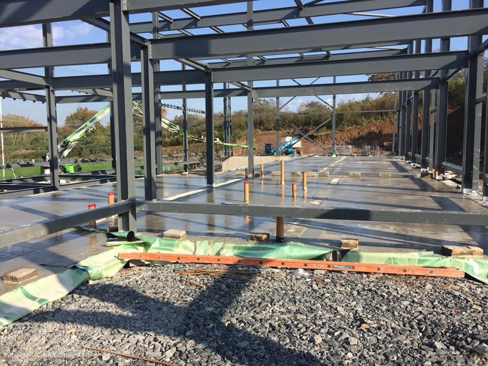 Floors poured and structural steel in place