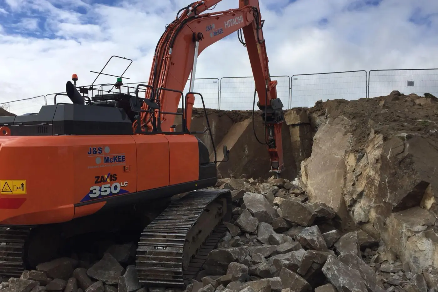 Hitachi 350 breaking rock