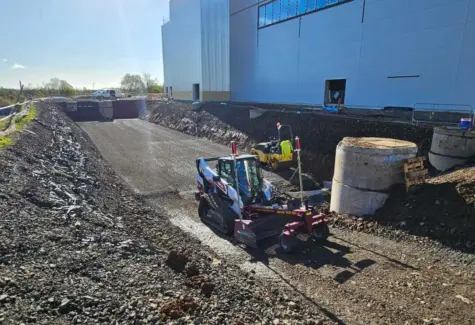 Area for attenuation tank precisely graded using Bobcat equipped with Sharpgrade and machine control