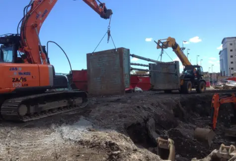 Lifting trench box into position JPG