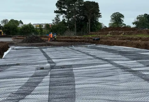 Geotextile and geogrid layers