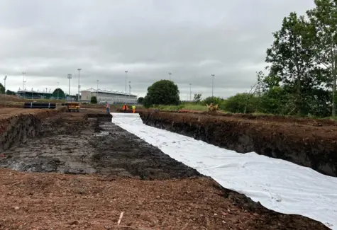 Laying geotextile