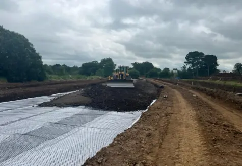 Dozer at work spreading stone