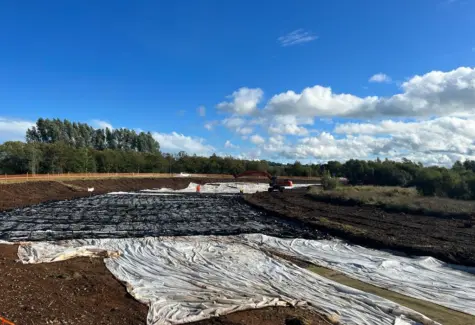 St Patricks Link Road layers of geotextile and geogrid being laid