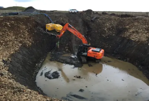 Breaking rock for wind turbine base JPG